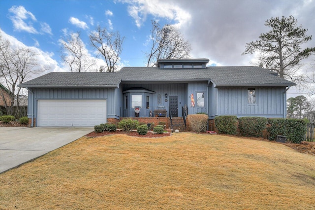 view of front of property featuring a shingled roof, covered porch, an attached garage, driveway, and a front lawn