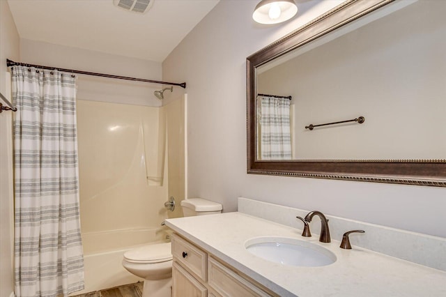 bathroom with toilet, shower / bath combo, visible vents, and vanity