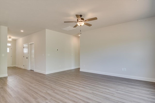 empty room featuring recessed lighting, visible vents, a ceiling fan, wood finished floors, and baseboards