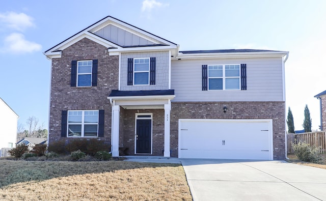 view of front of house featuring a front yard and a garage