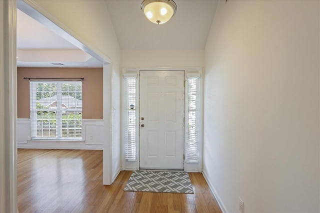 2071 Lake Forest Dr, Grovetown, GA 30813 - foyer entrance with light wood-style flooring, a wainscoted wall, and vaulted ceiling