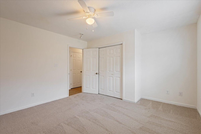 2071 Lake Forest Dr, Grovetown, GA 30813 - unfurnished bedroom featuring carpet, a closet, and ceiling fan