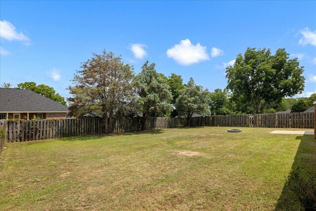 2071 Lake Forest Dr, Grovetown, GA 30813 - fenced backyard with a fire pit