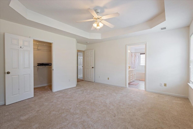 2071 Lake Forest Dr, Grovetown, GA 30813 - unfurnished bedroom with carpet, a raised ceiling, and a walk in closet