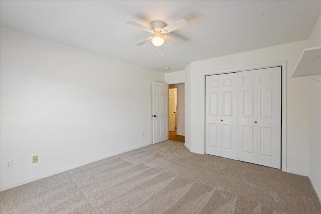 2071 Lake Forest Dr, Grovetown, GA 30813 - unfurnished bedroom with carpet, a closet, and ceiling fan