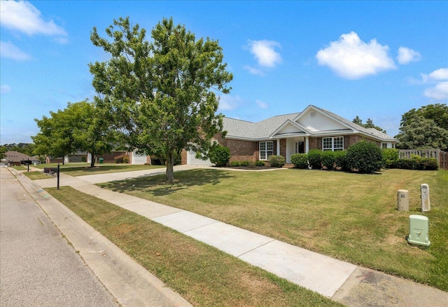 2071 Lake Forest Dr, Grovetown, GA 30813 - single story home featuring a garage, concrete driveway, a front lawn, and brick siding