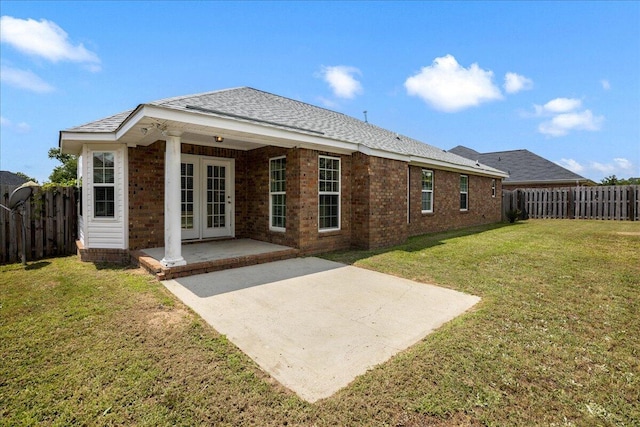 2071 Lake Forest Dr, Grovetown, GA 30813 - back of property with french doors, a fenced backyard, a patio, brick siding, and a shingled roof