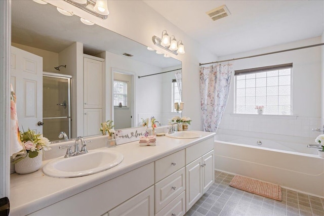 2071 Lake Forest Dr, Grovetown, GA 30813 - full bathroom with double vanity, plenty of natural light, and tile patterned floors