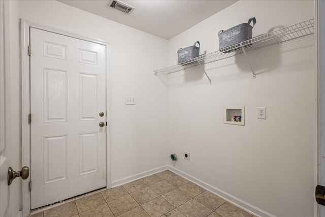 2071 Lake Forest Dr, Grovetown, GA 30813 - laundry area featuring hookup for a washing machine, electric dryer hookup, and light tile patterned floors
