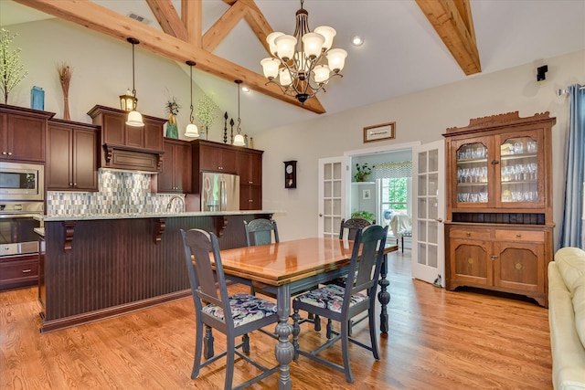 203 Jacque Cir, Mccormick, SC 29835 - dining area featuring a chandelier, light wood finished floors, and french doors