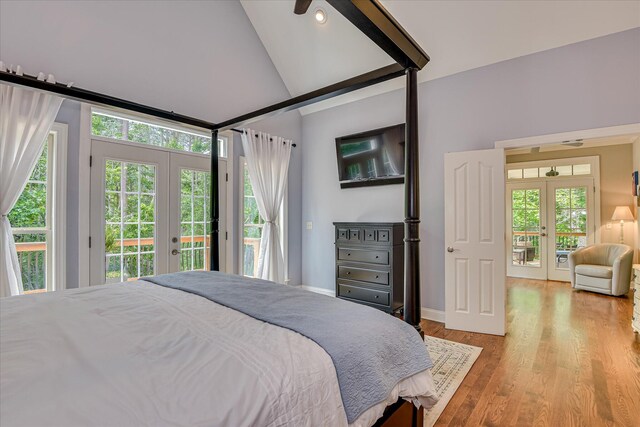 203 Jacque Cir, Mccormick, SC 29835 - bedroom with french doors, access to exterior, multiple windows, vaulted ceiling, and wood finished floors