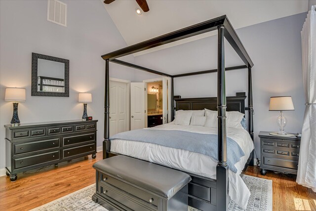 203 Jacque Cir, Mccormick, SC 29835 - bedroom featuring wood finished floors, ensuite bath, high vaulted ceiling, and baseboards