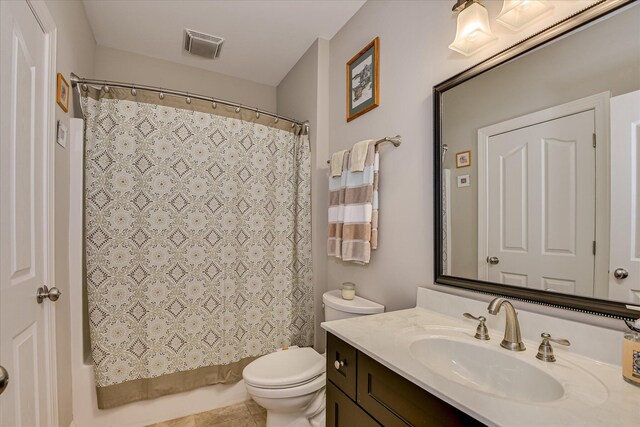 203 Jacque Cir, Mccormick, SC 29835 - bathroom featuring vanity, toilet, and shower / bath combo with shower curtain