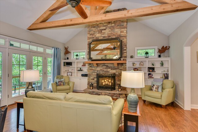 203 Jacque Cir, Mccormick, SC 29835 - living room with beam ceiling, wood finished floors, plenty of natural light, ceiling fan, and high vaulted ceiling