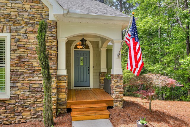 203 Jacque Cir, Mccormick, SC 29835 - entrance to property with stone siding and roof with shingles