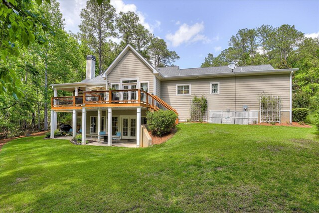 203 Jacque Cir, Mccormick, SC 29835 - rear view of house with french doors, a wooden deck, a patio, a chimney, and a lawn