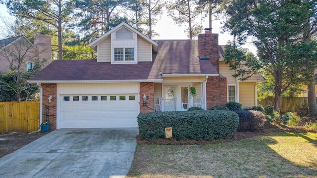 view of front of house featuring brick siding, a chimney, concrete driveway, and fence