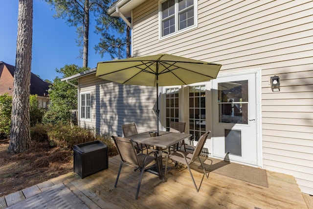 wooden deck with outdoor dining area