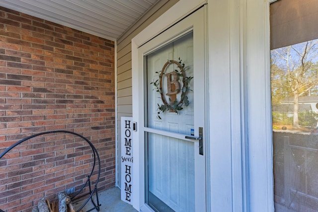 entrance to property with brick siding