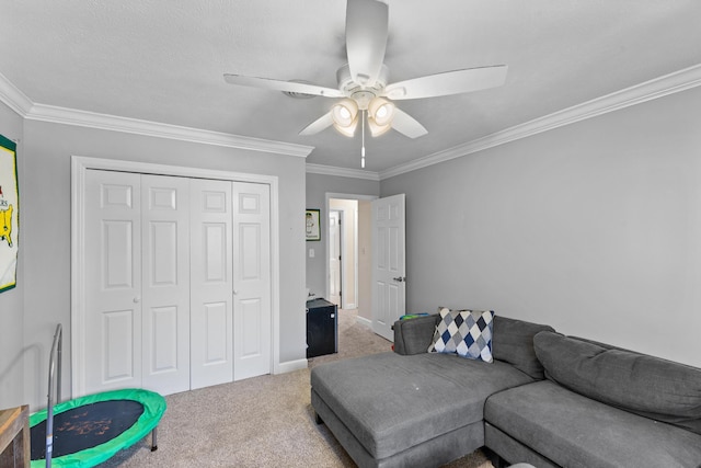 living area featuring carpet flooring, baseboards, crown molding, and ceiling fan