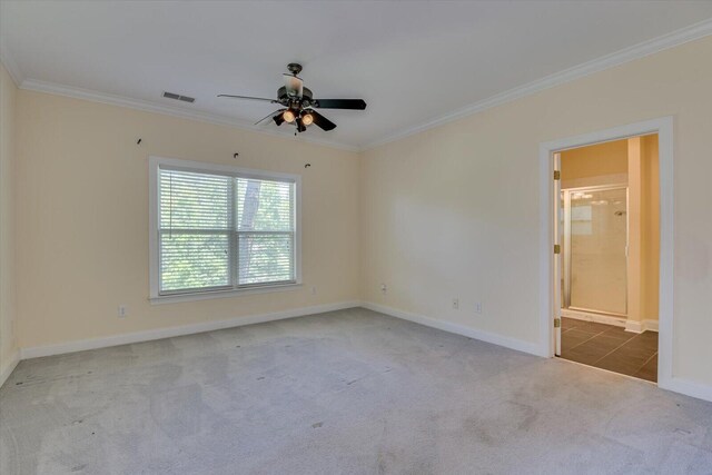 spare room featuring carpet flooring, ceiling fan, and ornamental molding