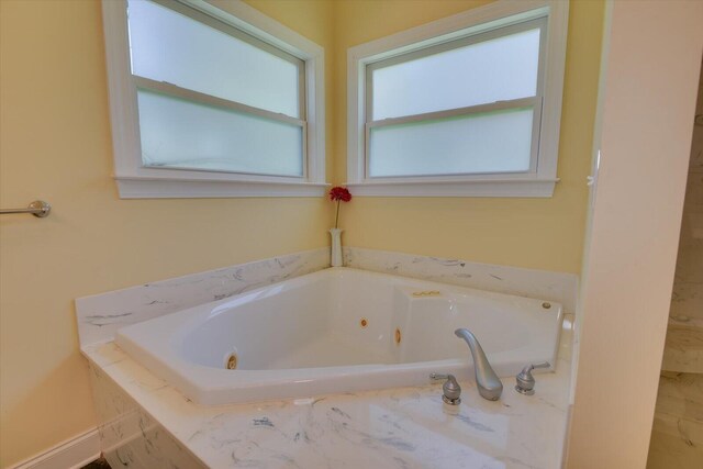 bathroom with tiled tub