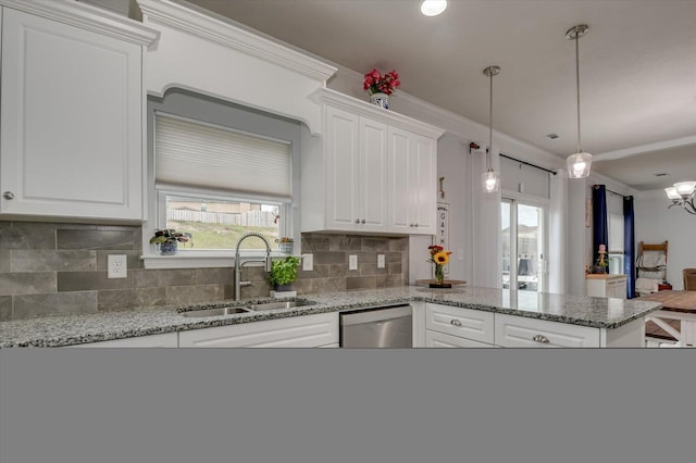 kitchen featuring backsplash, stainless steel dishwasher, ornamental molding, sink, and white cabinetry