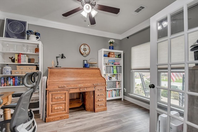 home office featuring ceiling fan, hardwood / wood-style floors, and ornamental molding