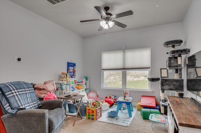 recreation room featuring carpet flooring and ceiling fan