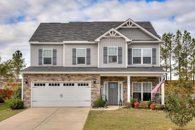 craftsman-style house with a garage and a front lawn