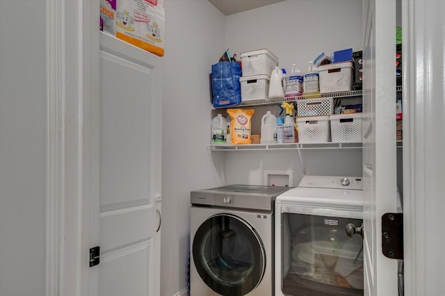 washroom featuring independent washer and dryer