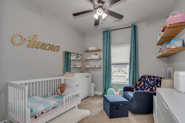 bedroom with ceiling fan and light carpet