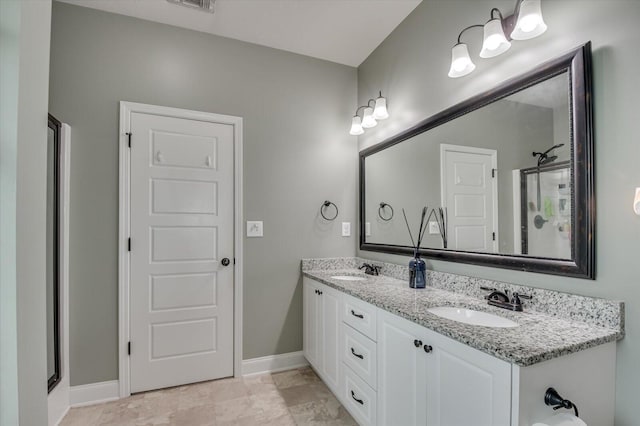 bathroom featuring vanity and a shower with door