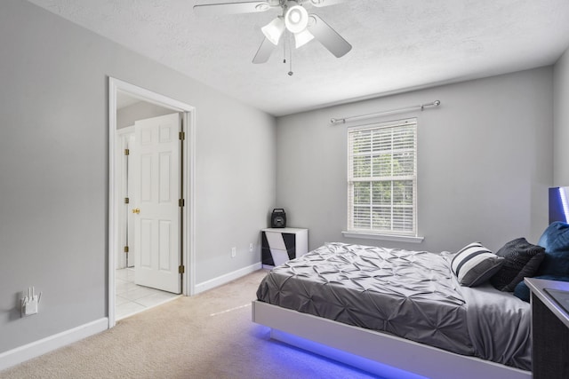 1629 Jamestown Ave, Evans, GA 30809 - carpeted bedroom with baseboards, a ceiling fan, and a textured ceiling