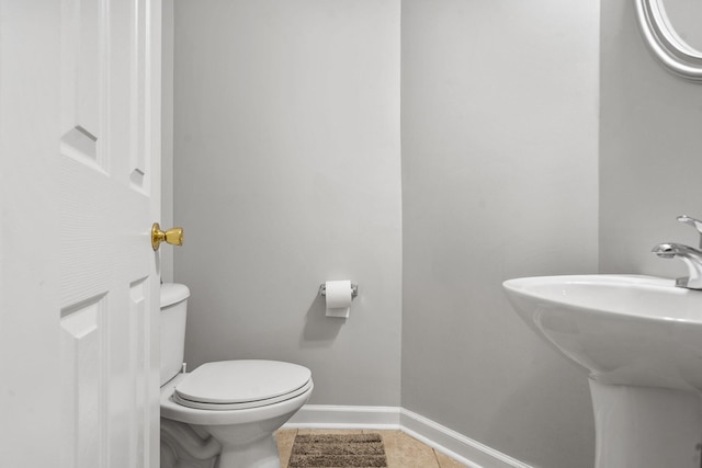 1629 Jamestown Ave, Evans, GA 30809 - bathroom with toilet, a sink, baseboards, and tile patterned flooring