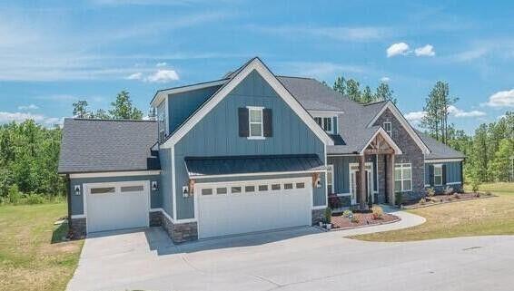 view of front facade with a garage and a front lawn