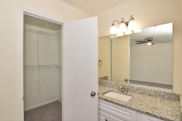 bathroom featuring vanity and ceiling fan