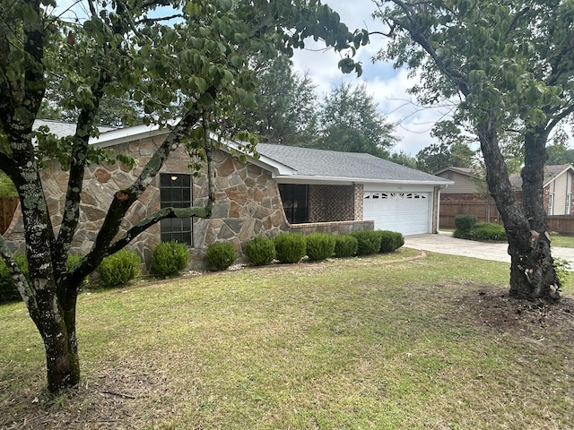 single story home with a garage and a front yard