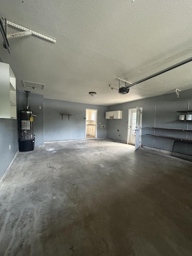 garage with strapped water heater and a garage door opener