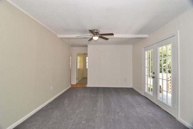 spare room with beamed ceiling, french doors, a textured ceiling, and ceiling fan