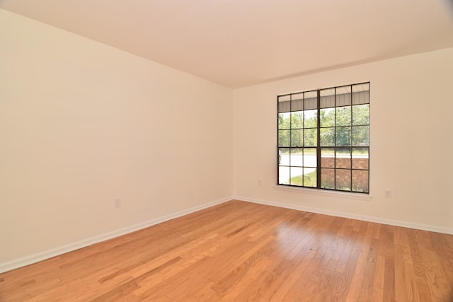 spare room featuring light hardwood / wood-style flooring