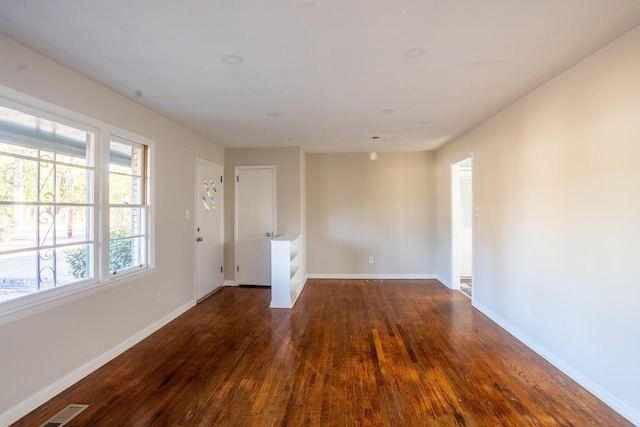 unfurnished room featuring dark hardwood / wood-style floors