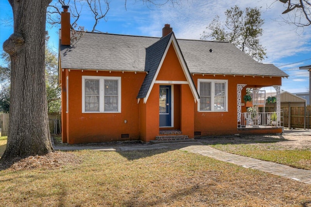 rear view of house featuring a chimney, a shingled roof, a lawn, crawl space, and fence