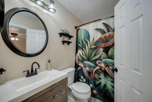 bathroom featuring a textured ceiling, vanity, toilet, and a shower with curtain