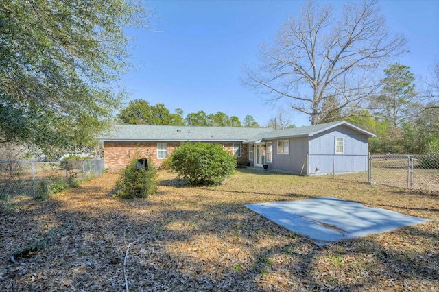 back of house featuring a patio area and fence