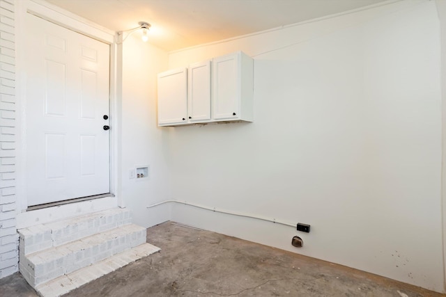 laundry area featuring washer hookup and cabinets