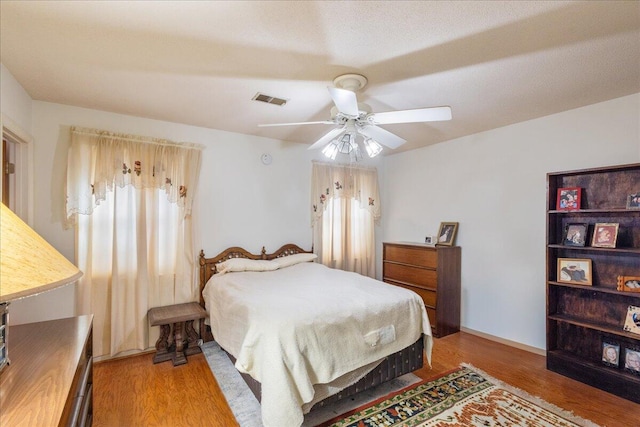 bedroom featuring ceiling fan and light wood-type flooring