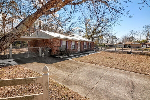 view of property exterior featuring a carport