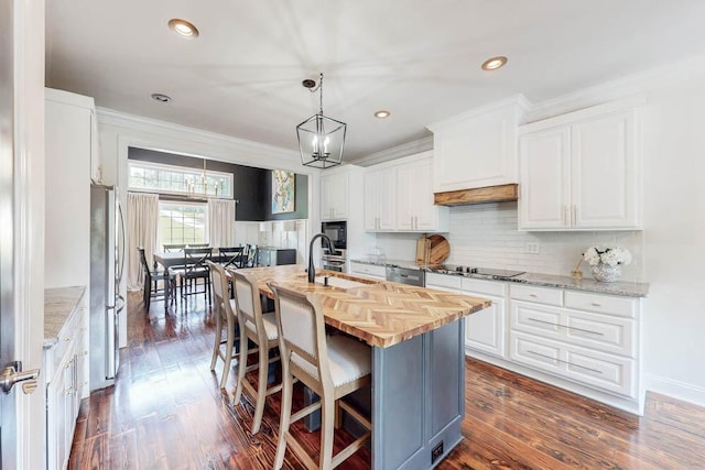 184 Deer Springs Rd, Clarks Hill, SC 29821 - kitchen with wood counters, stainless steel appliances, white cabinetry, a chandelier, and crown molding