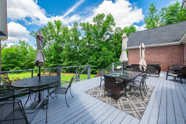 184 Deer Springs Rd, Clarks Hill, SC 29821 - wooden terrace with outdoor dining space, a lawn, and view of wooded area